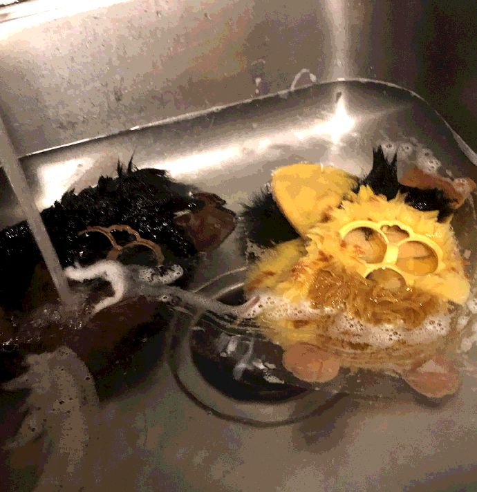 a photo of two furby pelts in a sink